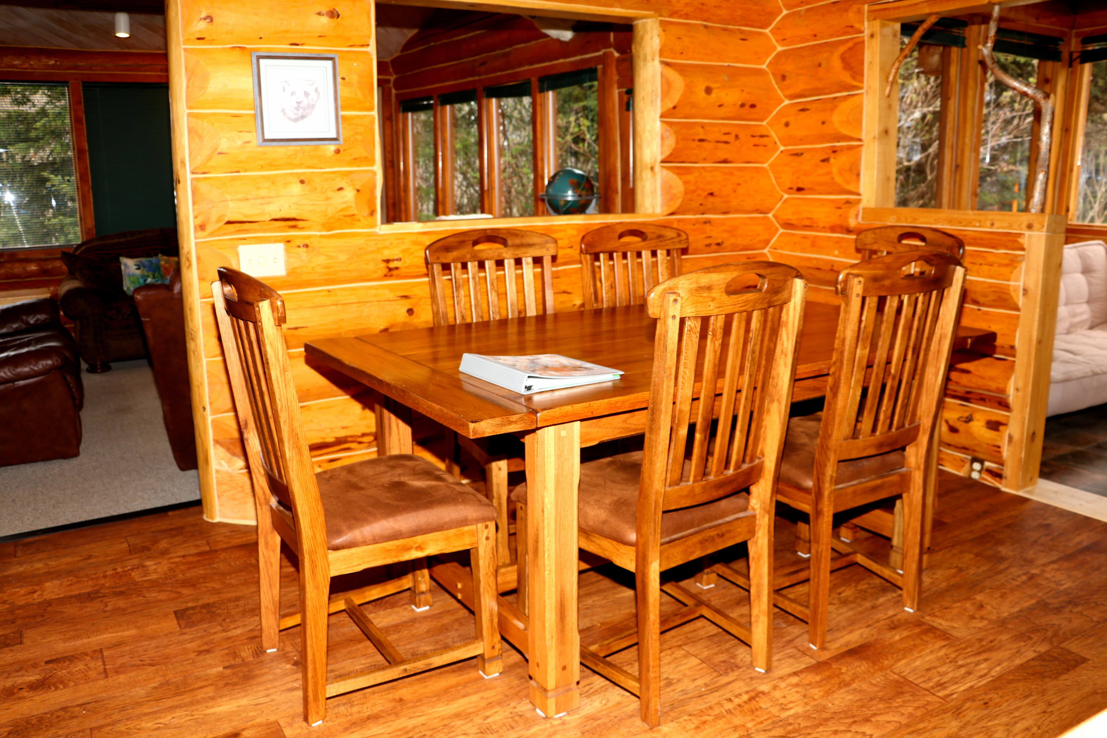 Wooden dining table and six matching chairs.